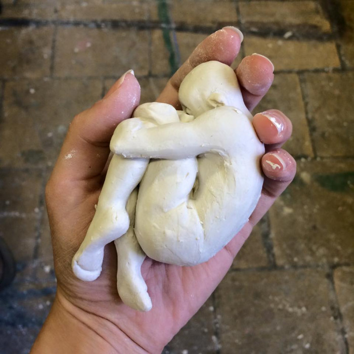 White ceramic figurine in the sleeping position